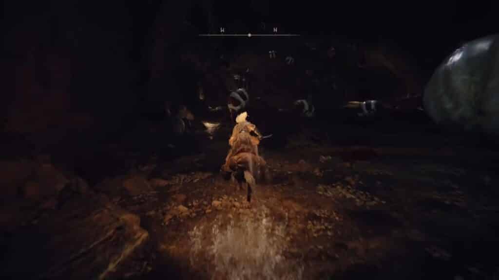 Follow the left wall of the cave to reach the adjacent cave opening - Elden Ring How to Get the Elden Stars Incantation